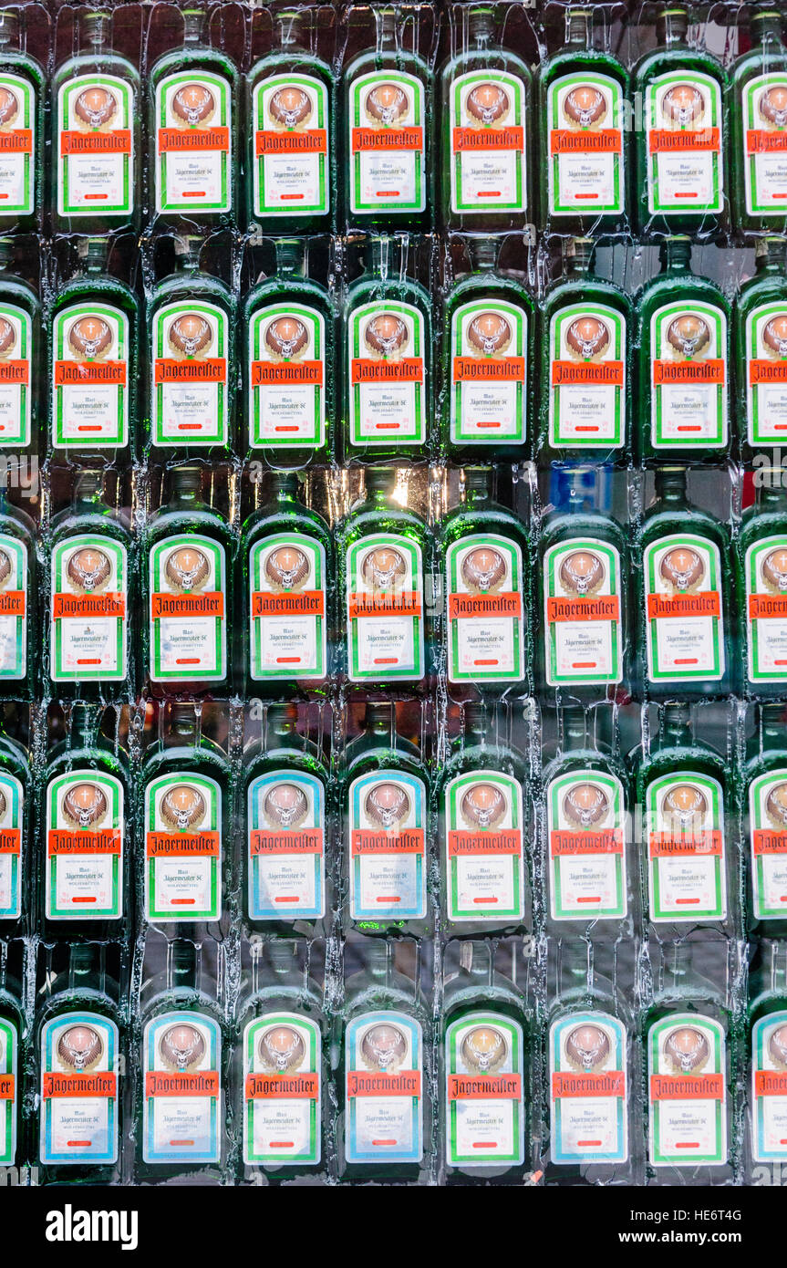 Large number of bottles of Jagermeister in the window of a shop. Stock Photo
