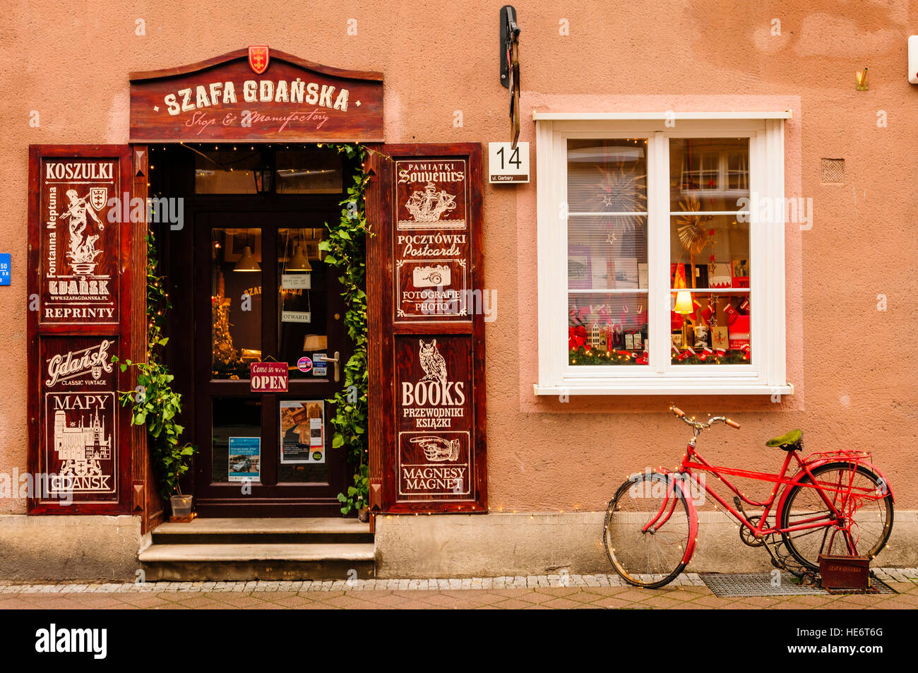 Red bicycle outside a book store in Gdansk, Poland Stock Photo