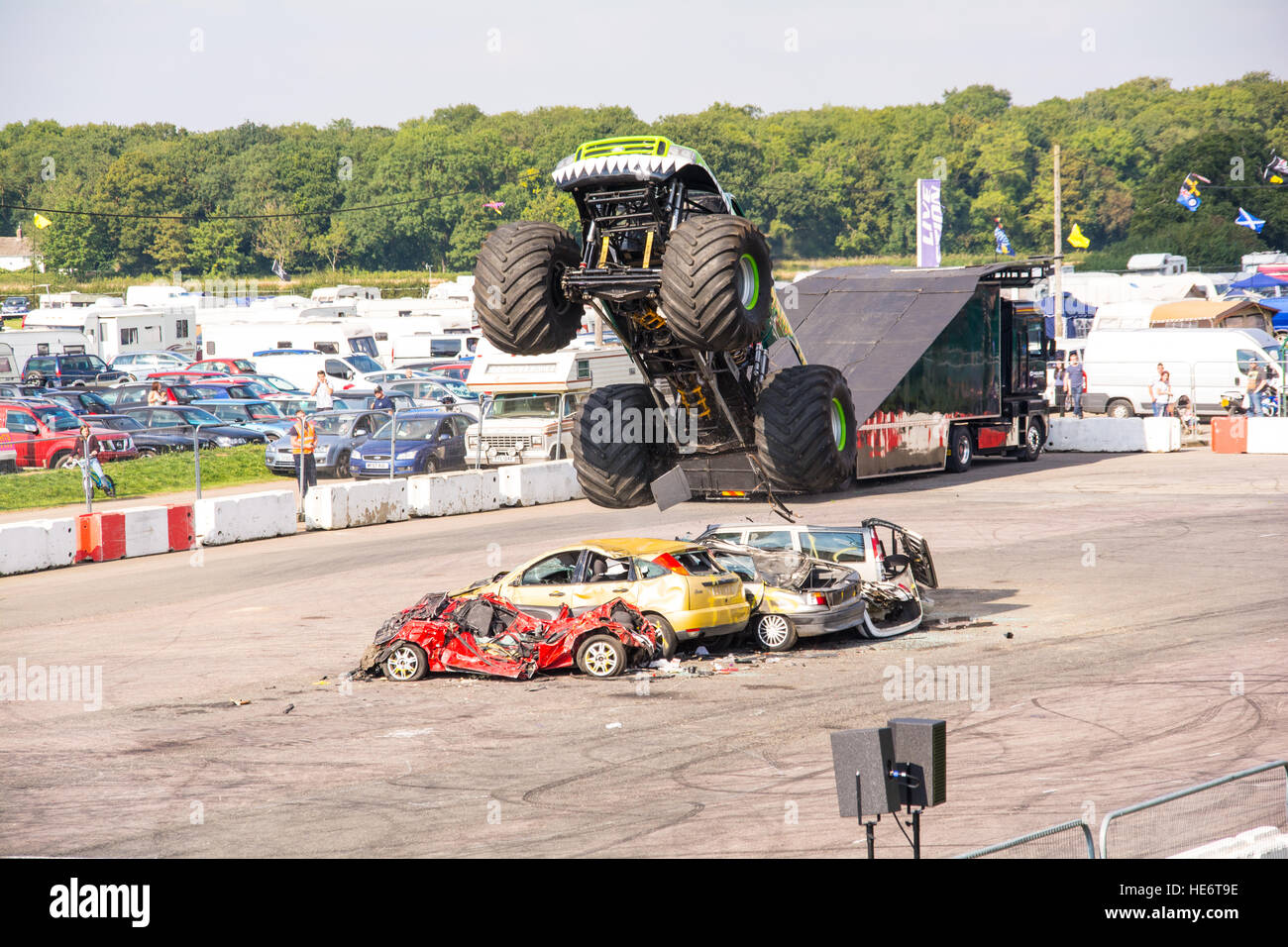 Big car jumping over a line of cars Stock Photo Alamy