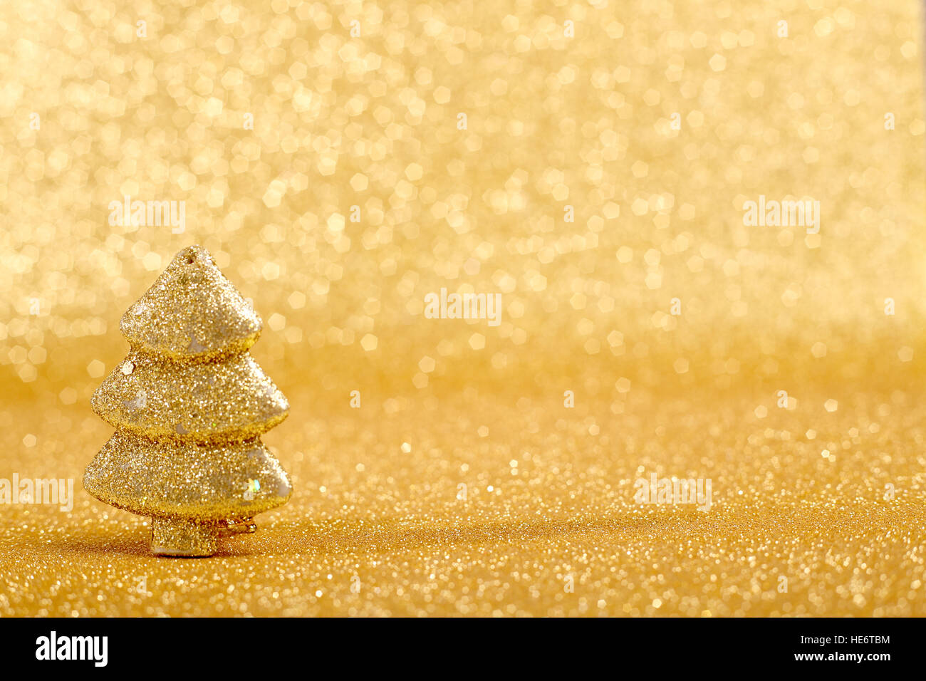 Golden christmas fir tree decoration on glitter background Stock Photo ...
