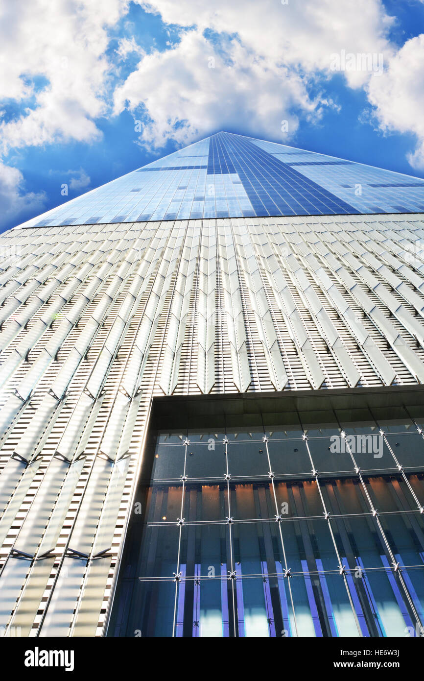 Tall skyscraper in Manhattan New York with blue sky and clouds Stock ...
