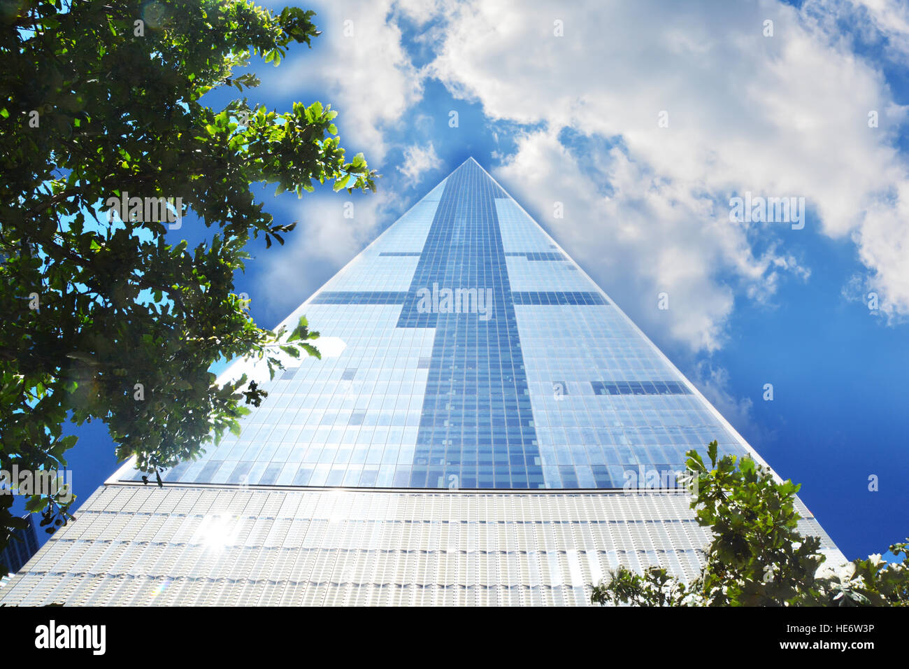 Tall skyscraper in Manhattan New York with blue sky and clouds Stock ...