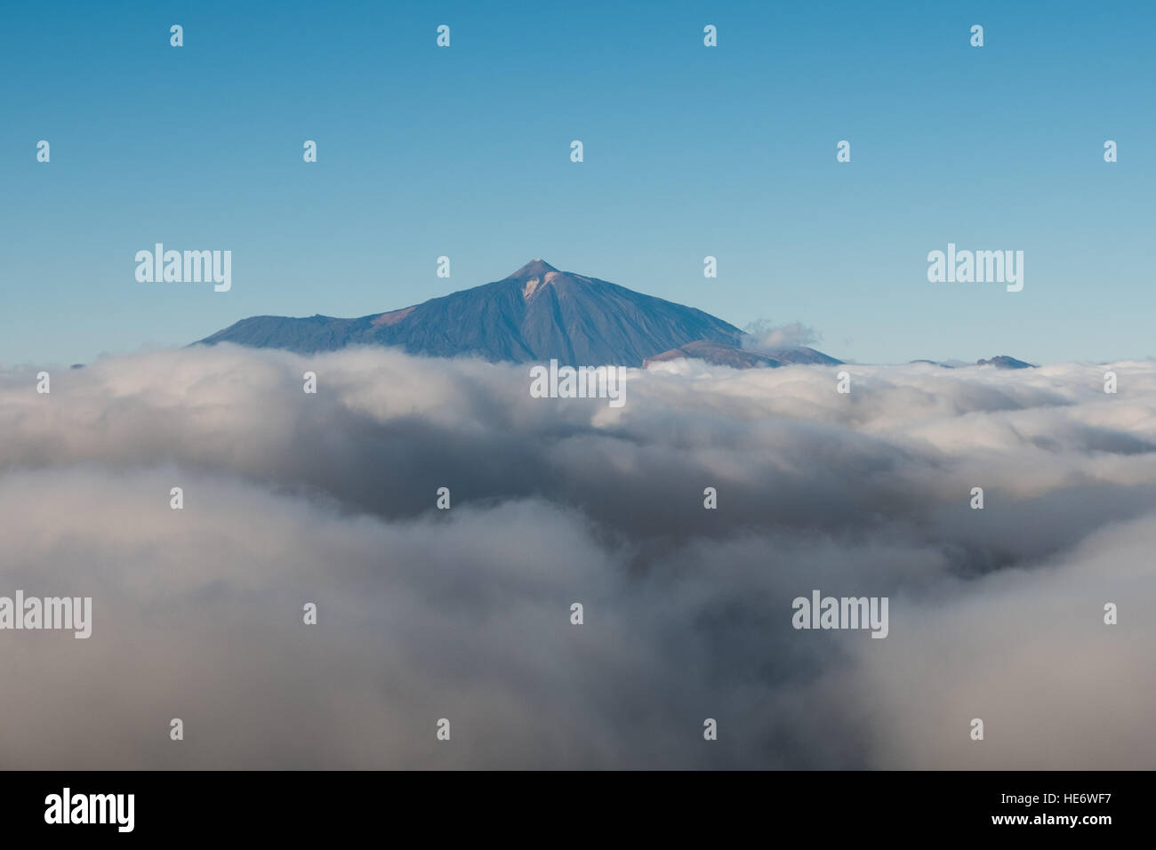 mountain summit above clouds, Pico del Teide, Tenerife Stock Photo