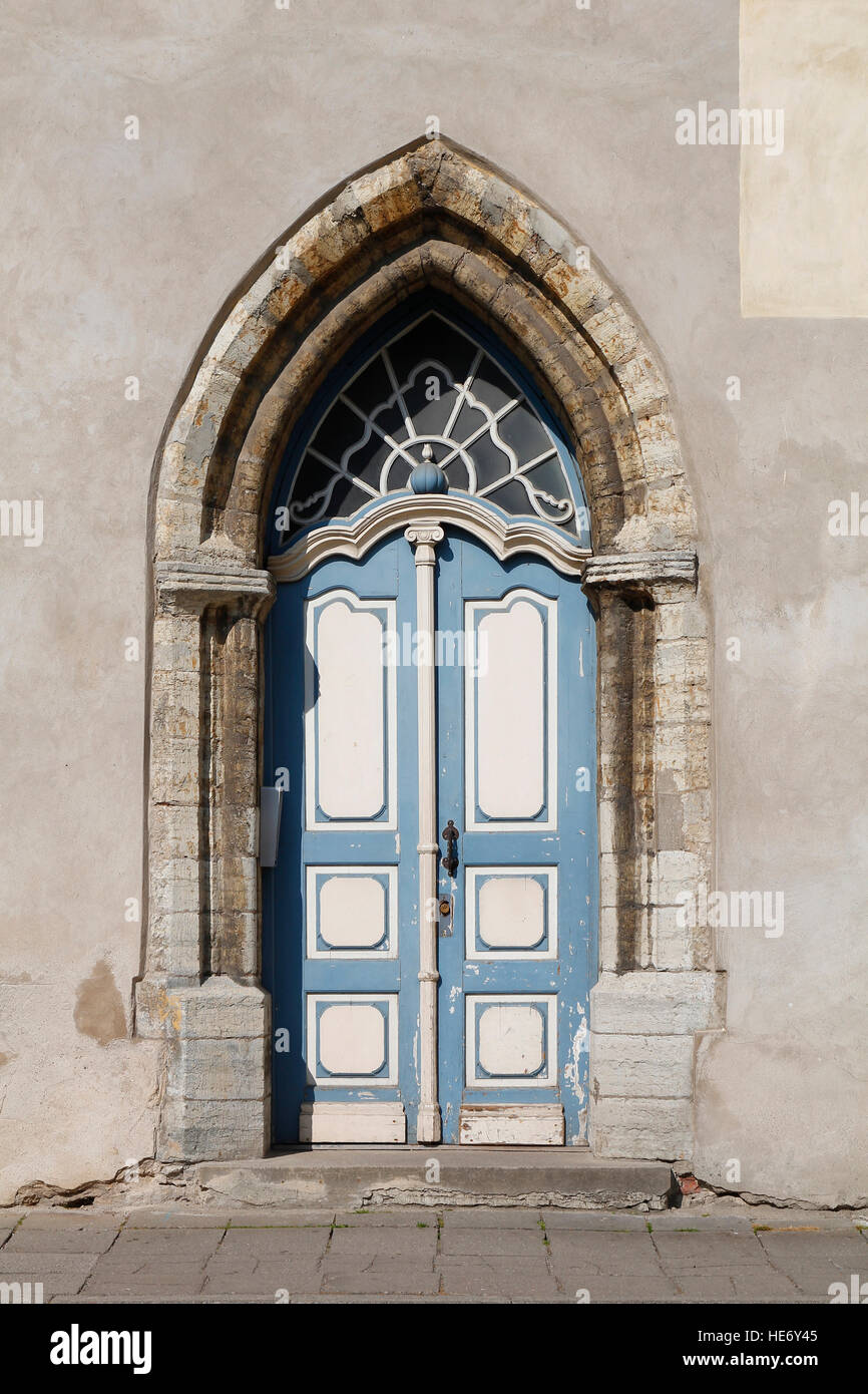 Old wooden door with a big stone arch, in an old facade Stock Photo - Alamy