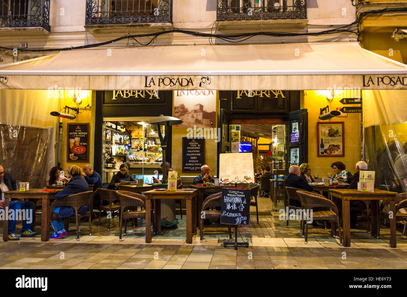 Taberna, La posada, typical spanish tapas bar in centre of Malaga at night,  Malaga, Andalusia, Spain Stock Photo - Alamy
