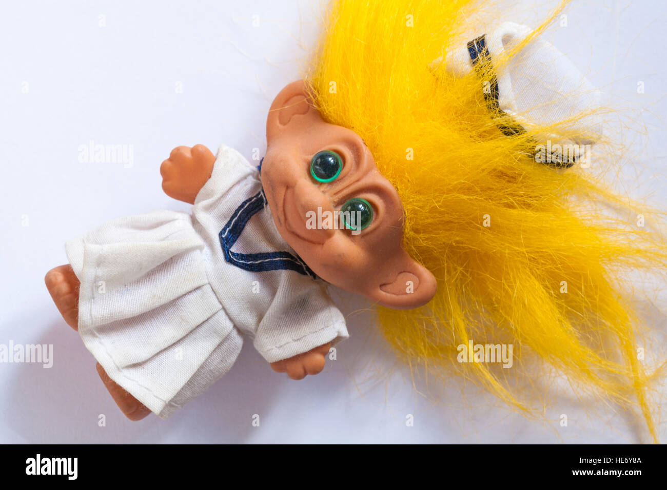 troll doll with yellow hair in uniform Stock Photo