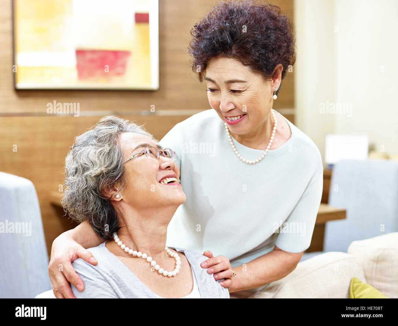 two senior asian women showing care and friendship Stock Photo
