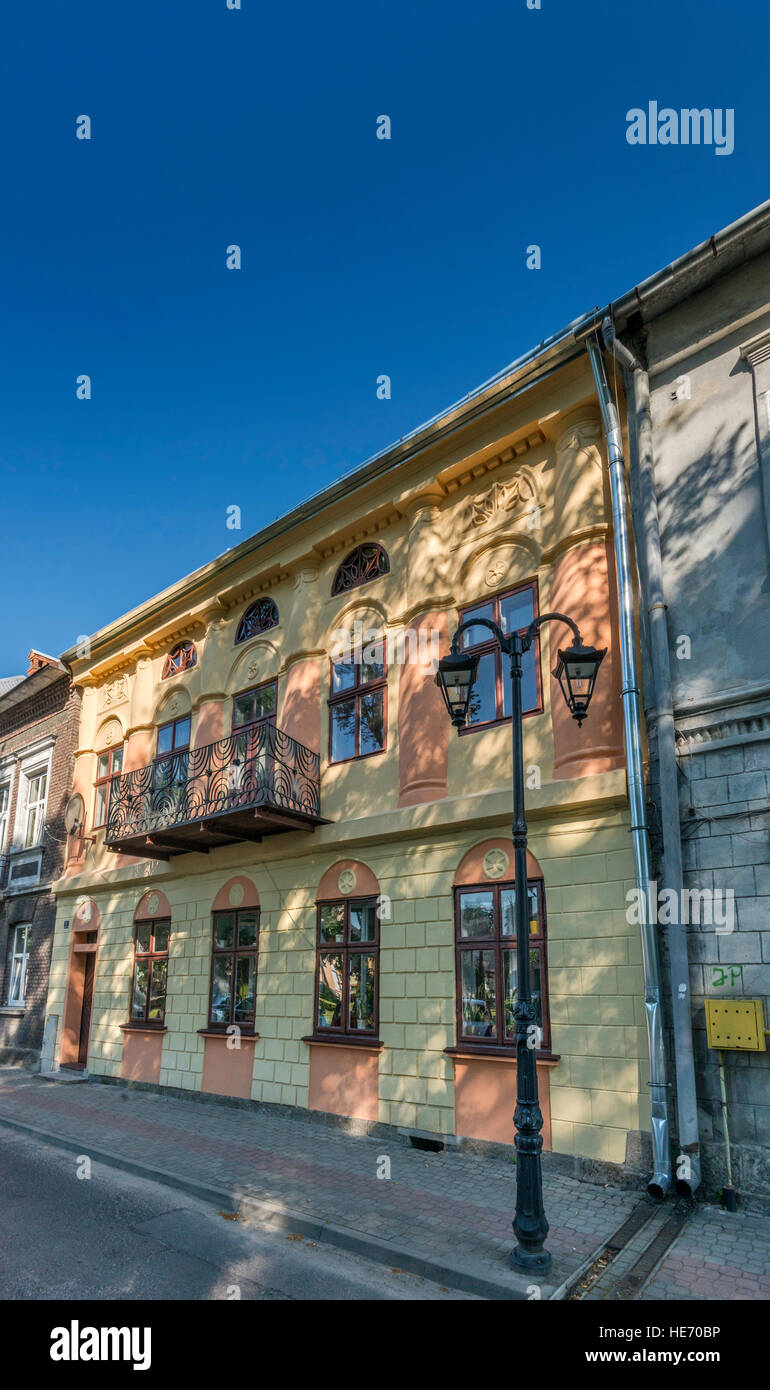 Apartment house with balcony using metal elements removed during WW2 from bimah at synagogue, in Lesko, Bieszczady region, Malopolska, Poland Stock Photo
