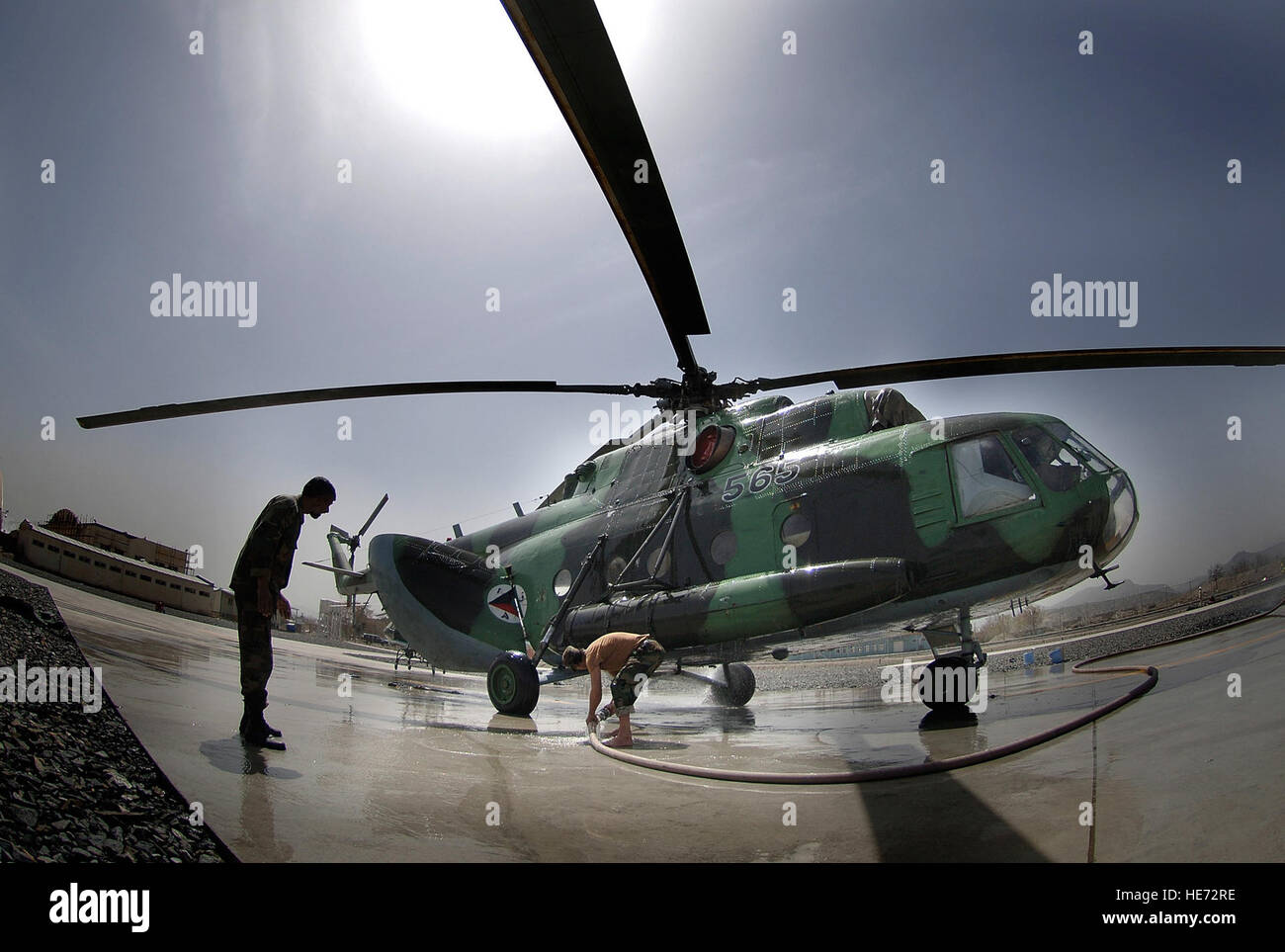 Afghan National Air Corp maintainers wash down an MI-17 HIP H helicopter at the Kabul International Airport flightline in Kabul, Afghanistan, April 9, 2007.  Tech. Sgt. Cecilio M. Ricardo Jr.) (Released) Stock Photo