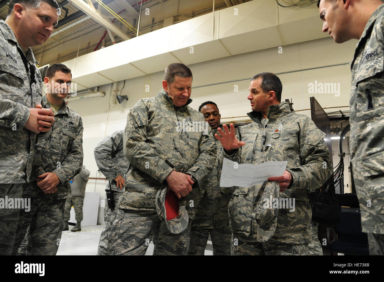 Maj. Matthew Drossner, the 509th Munitions Squadron commander, center ...