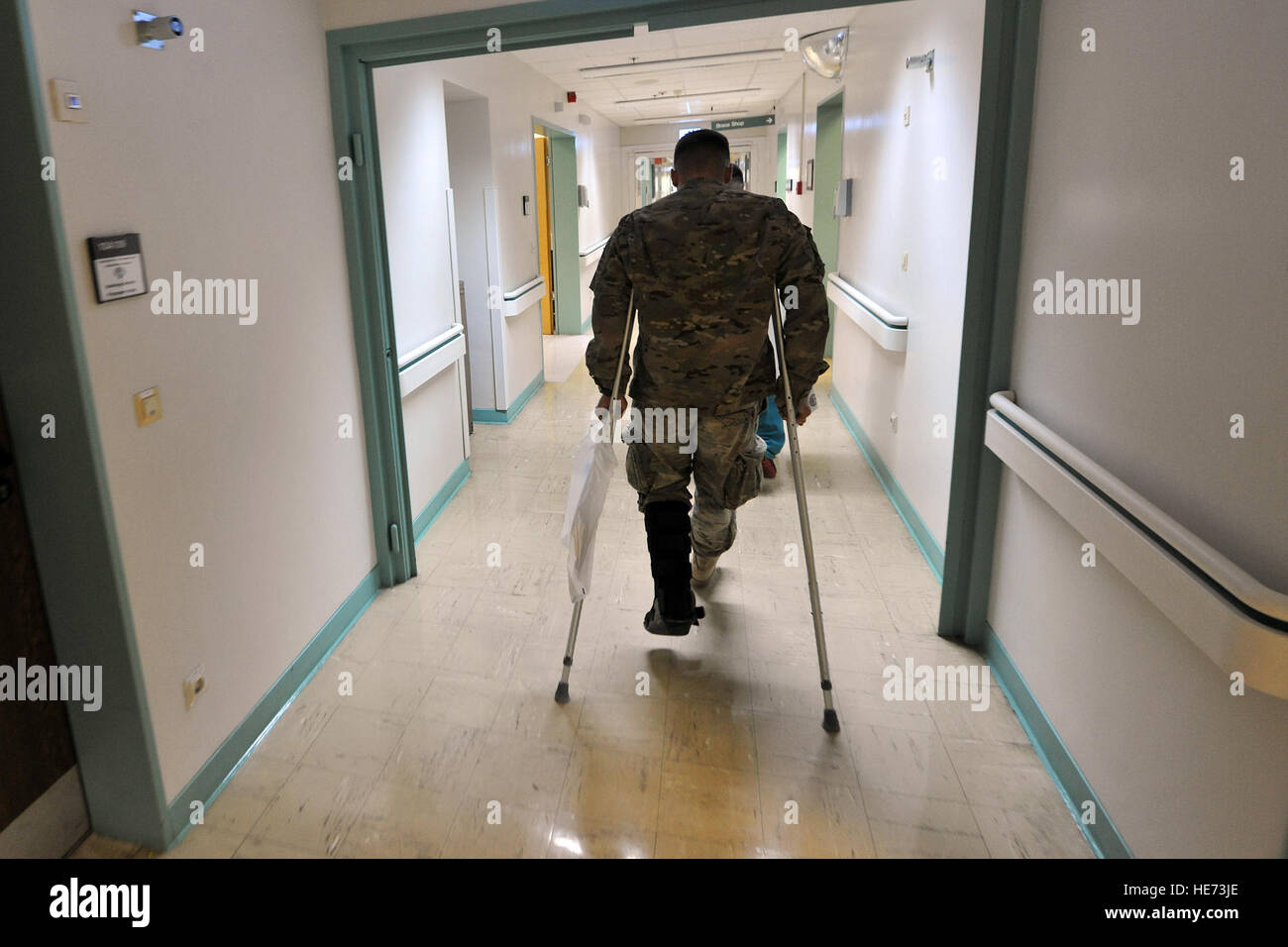 U.S. Army Sgt. Karl Berlinger makes his way to the orthopedic section for his initial observation Feb. 12, 2014, Landstuhl Regional Hospital, Germany. Berlinger received treatment for his injuries at LRMC within one hour of arrival from Bagram Air Field, Afghanistan. Senior Airman Chris Willis) Stock Photo