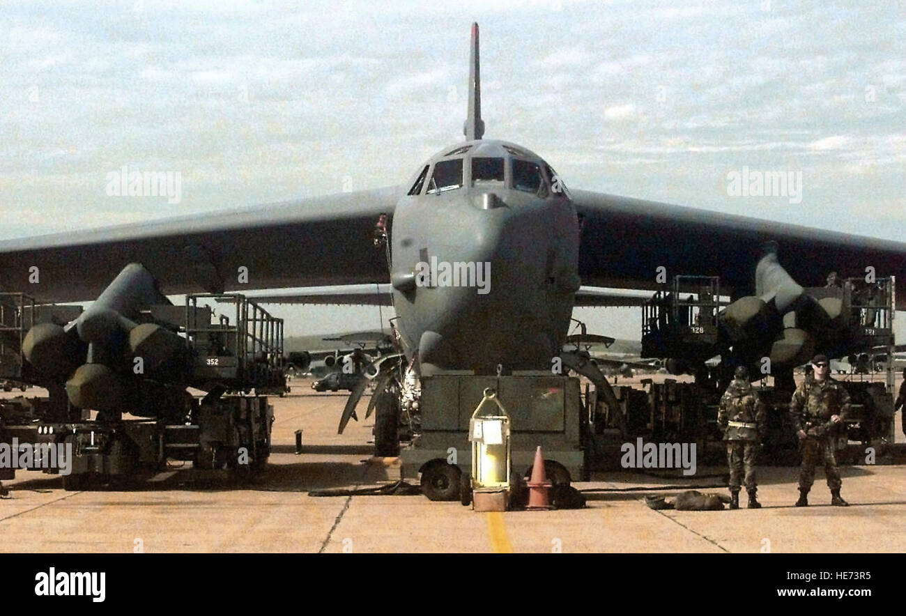 munitions-personnel-on-a-b-52-pylon-maintenanceloading-stands-from-HE73R5.jpg