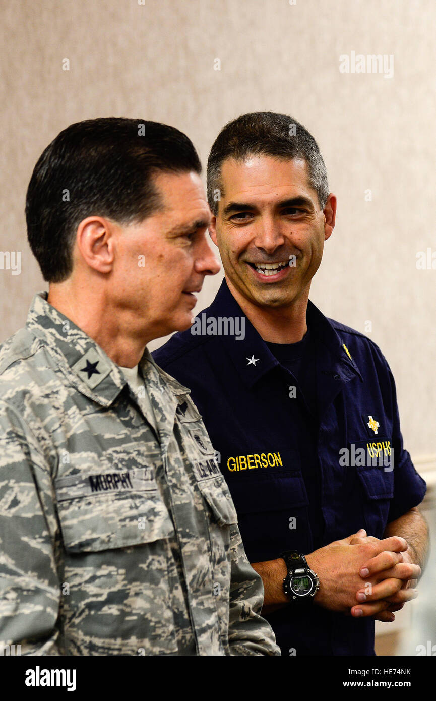 U.S. Navy Rear Adm. Scott Giberson, U.S. Public Health Services acting deputy surgeon general, meets with U.S. Air Force Brig. Gen. Sean Lee Murphy, Air Combat Command surgeon general, during a briefing at Langley Air Force Base, Va., Sept. 22, 2014. Giberson and other members of the USPHS visited Langley to tour the Air Force’s Expeditionary Medical Support System.  Senior Airman Kayla Newman Stock Photo