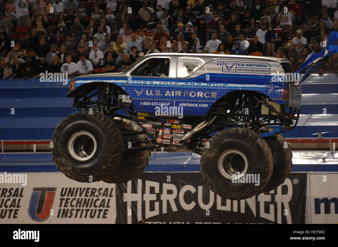Damon Bradshaw, the driver of the U.S. Air Force 'Afterburner' monster truck, flies through the obstacle course during the Monster Jam World Finals at Sam Boyd Stadium in Las Vegas, Nev., March 29, 2008.  Master Sgt. Kevin J. Gruenwald) (Released) Stock Photo