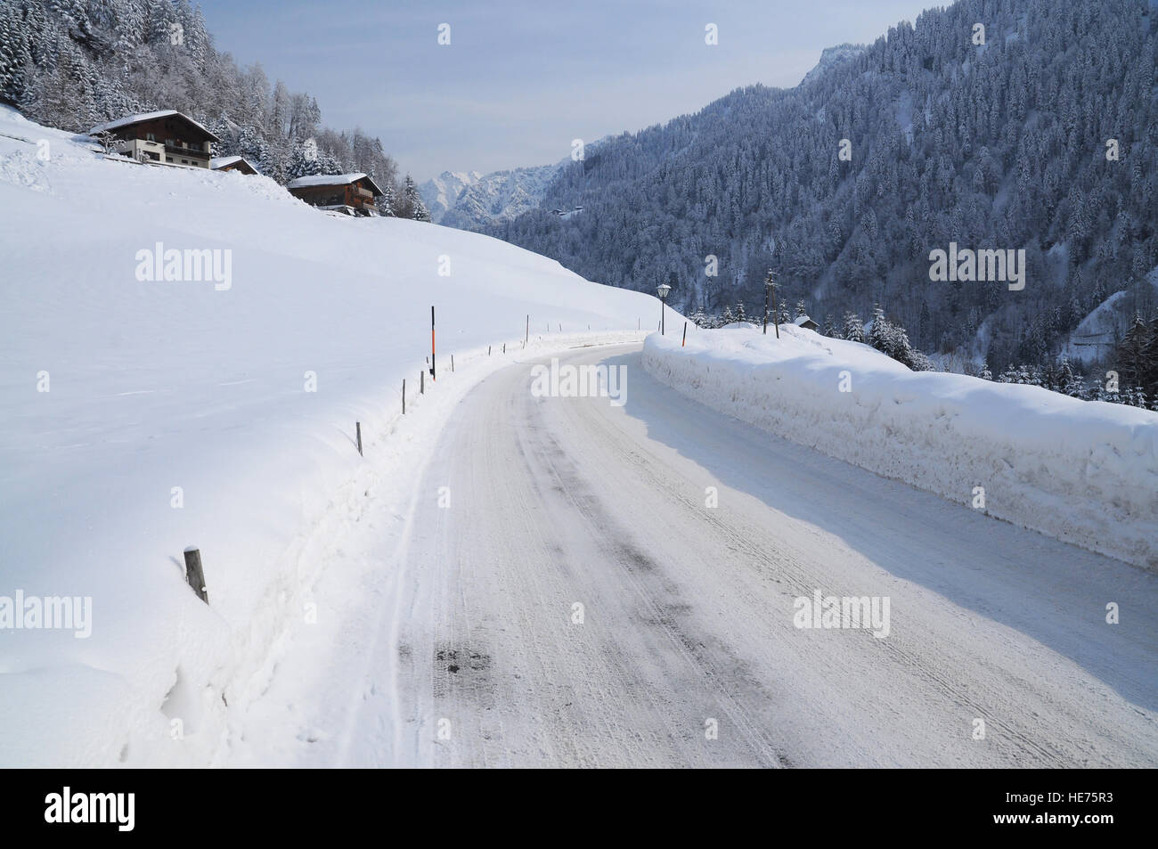 Snowy road in a mountain village Stock Photo