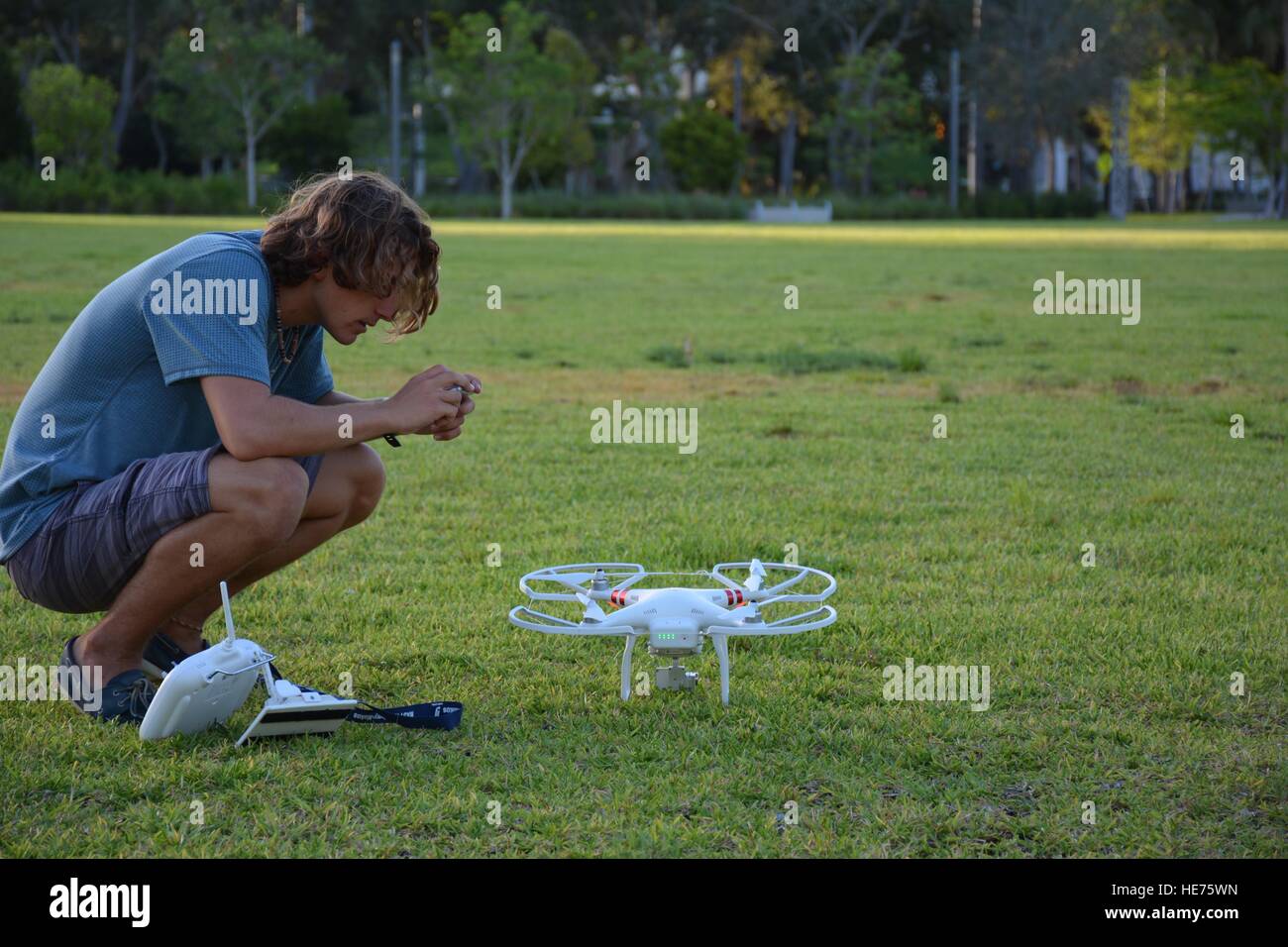 blond teenager preparing to fly a drone Stock Photo Alamy