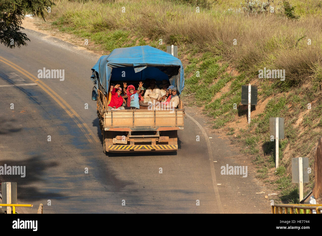 A flatbed truck, lorry, transporting laborers / rural workers in a rural road in Southeast Brazil. Stock Photo