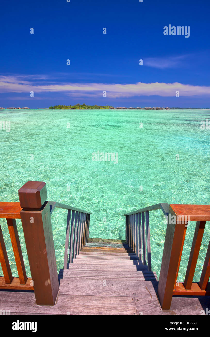 Stairs leading to tropical lagoon. Stock Photo