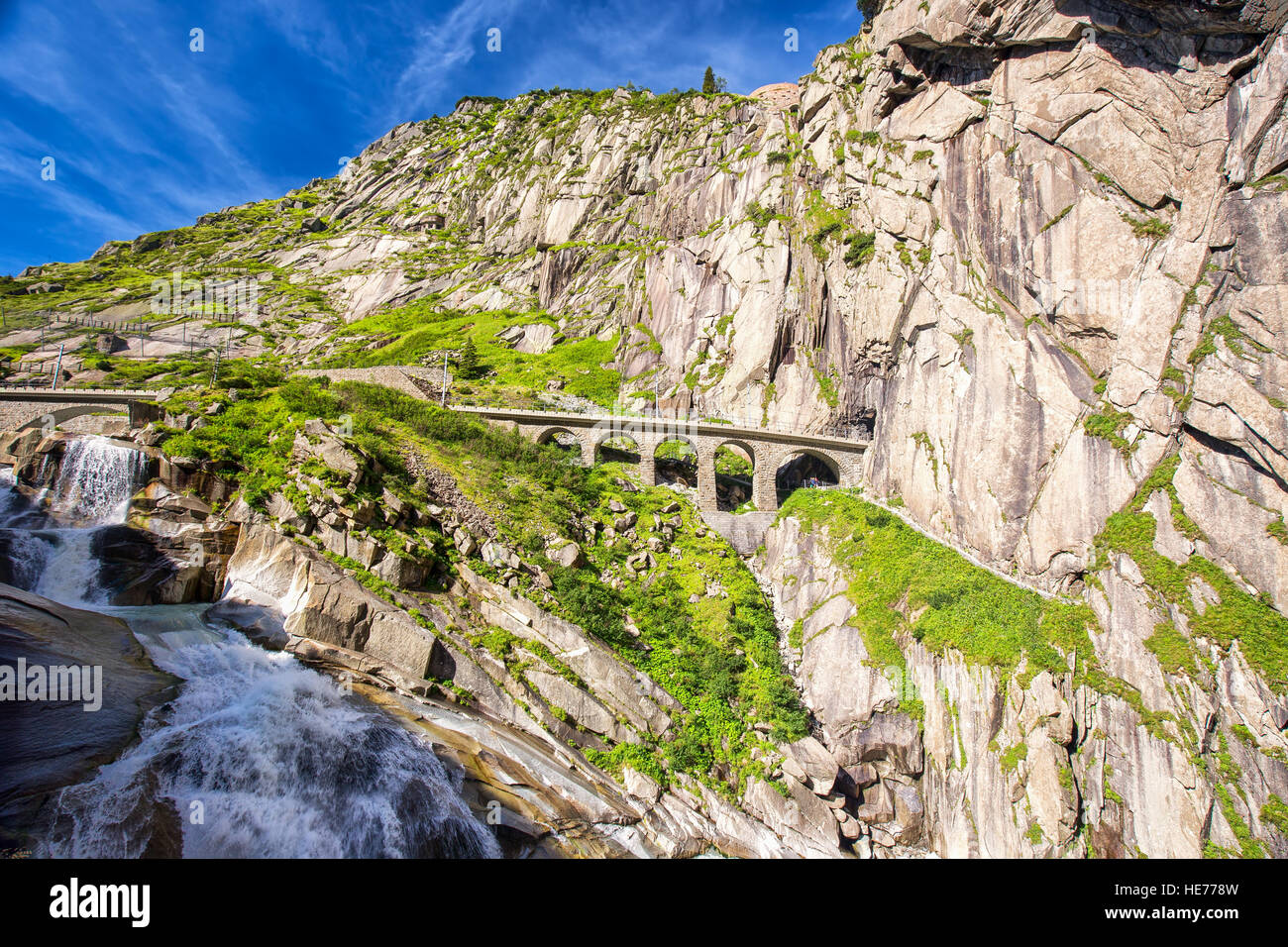 The railroad bridge Teufelsbrucke - Devil's bridge near Andermatt on Gotthard mountain pass road in Swiss Alps Stock Photo
