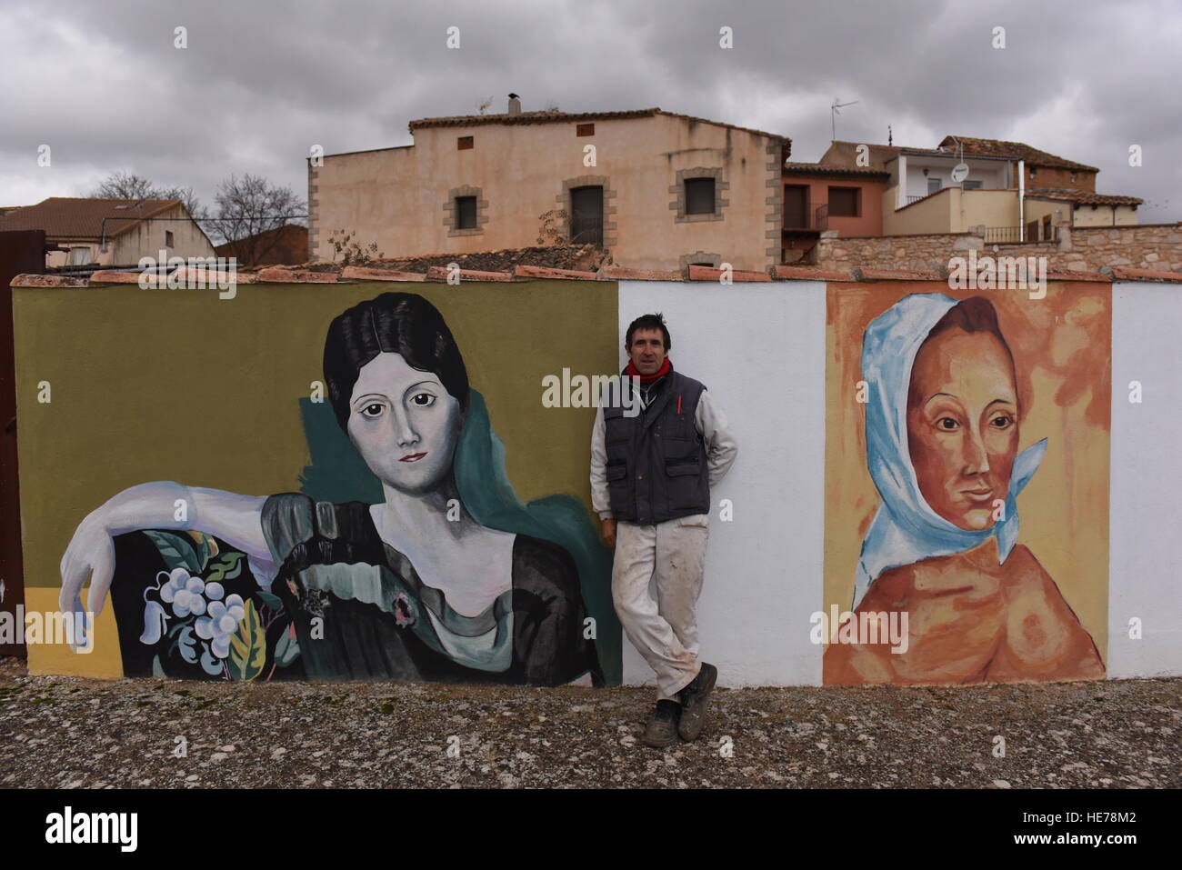 Caltojar, Spain. 17th Dec, 2016. A man walks past a wall painted with replicas of works by Spanish genius Pablo Picasso in Cartojar, north of Spain. © Jorge Sanz/Pacific Press/Alamy Live News Stock Photo