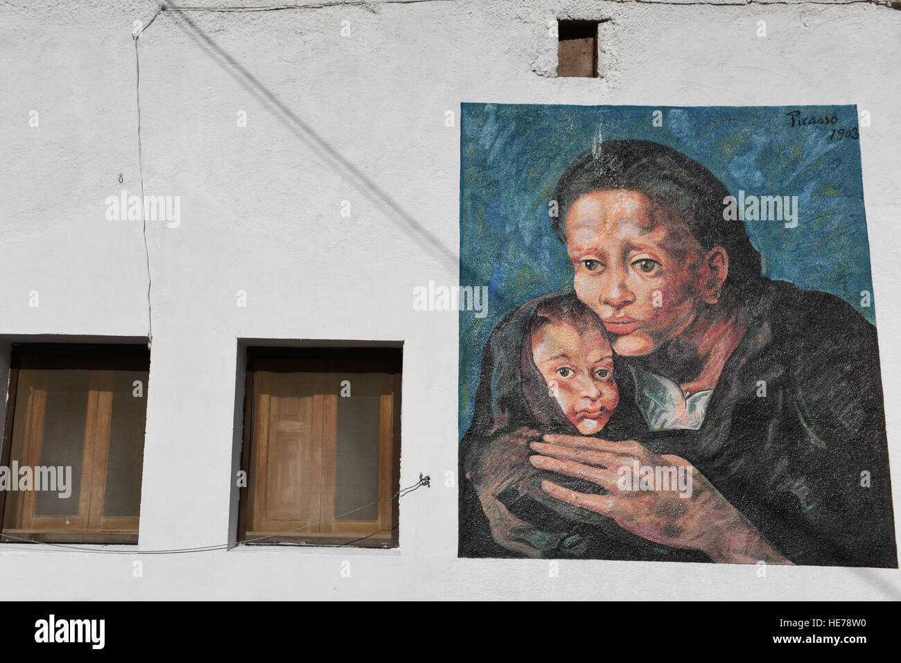 Caltojar, Spain. 17th Dec, 2016. A man walks past a wall painted with replicas of works by Spanish genius Pablo Picasso in Cartojar, north of Spain. © Jorge Sanz/Pacific Press/Alamy Live News Stock Photo