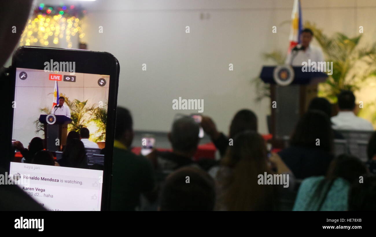 Davao City, Philippines. 17th Dec, 2016. Live streaming of Pres. Duterte's media briefing via smart-phone. Pres. Rodrigo Duterte told the United States on Saturday 'bye-bye America, and we don't need your money.' He also told the press during his arrival from state visit in Cambodia and Singapore that he is looking forward to visit Russia and meet Pres. Vladimir Putin. © Sherbien Dacalanio/Pacific Press/Alamy Live News Stock Photo