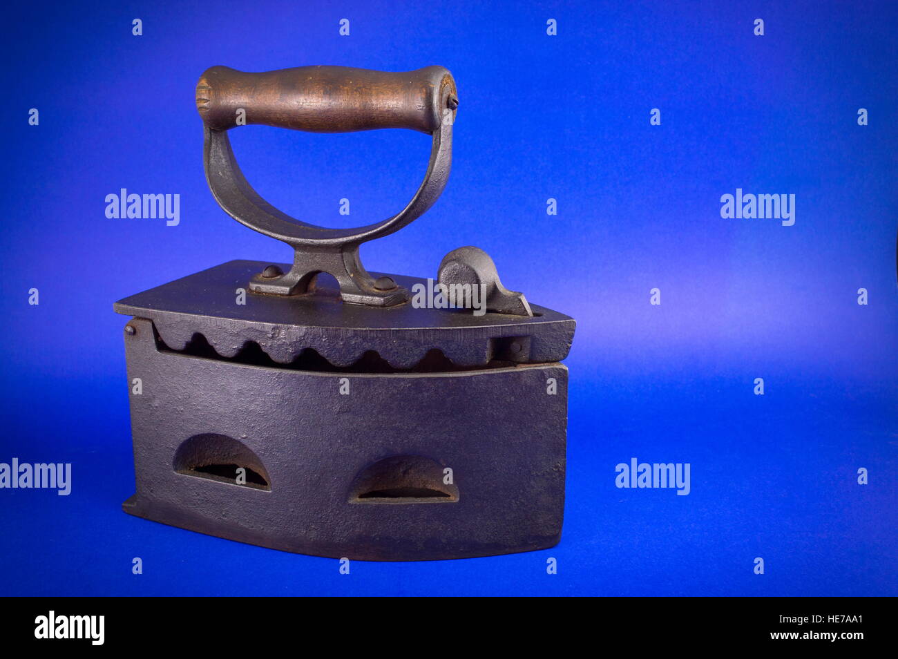 Vintage coal iron used with budning embers on blue Stock Photo Alamy