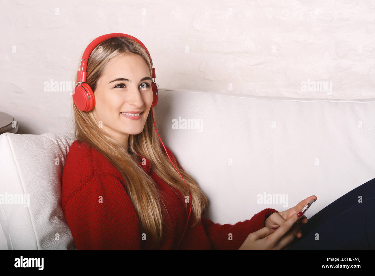 Portrait of young beautiful woman listening to music. Indoor Stock ...