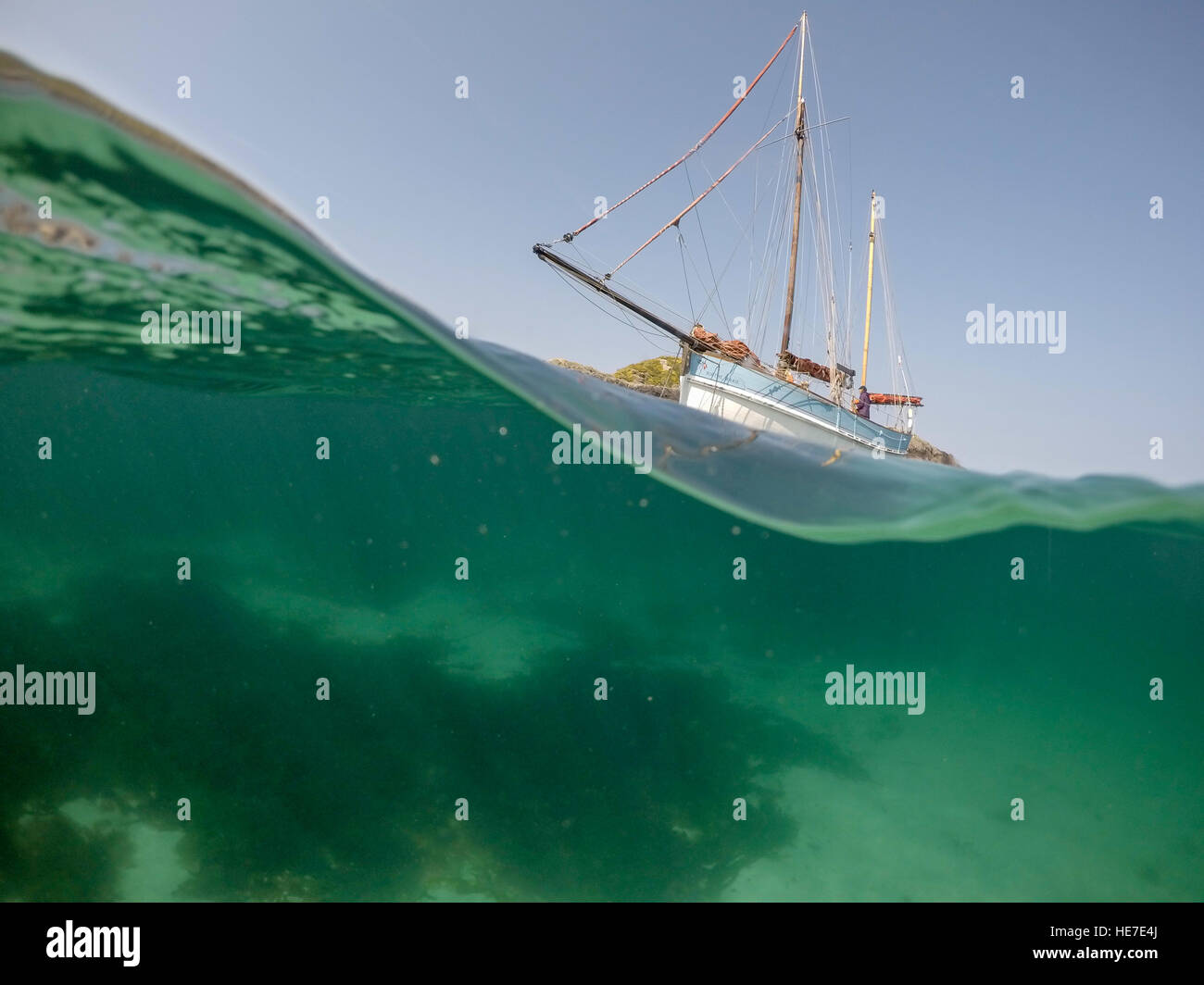 Underwater view of traditional sailing fishing boat anchored by the ...