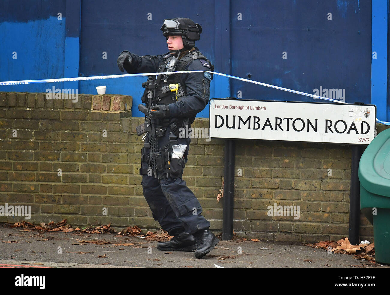 Police in Brixton near the scene at Dumbarton Road which was closed off