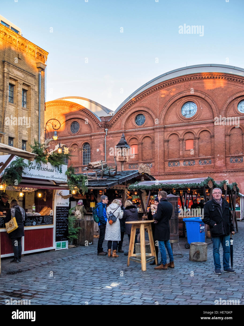 People enjoy Berlin Christmas market at old brewery building, German