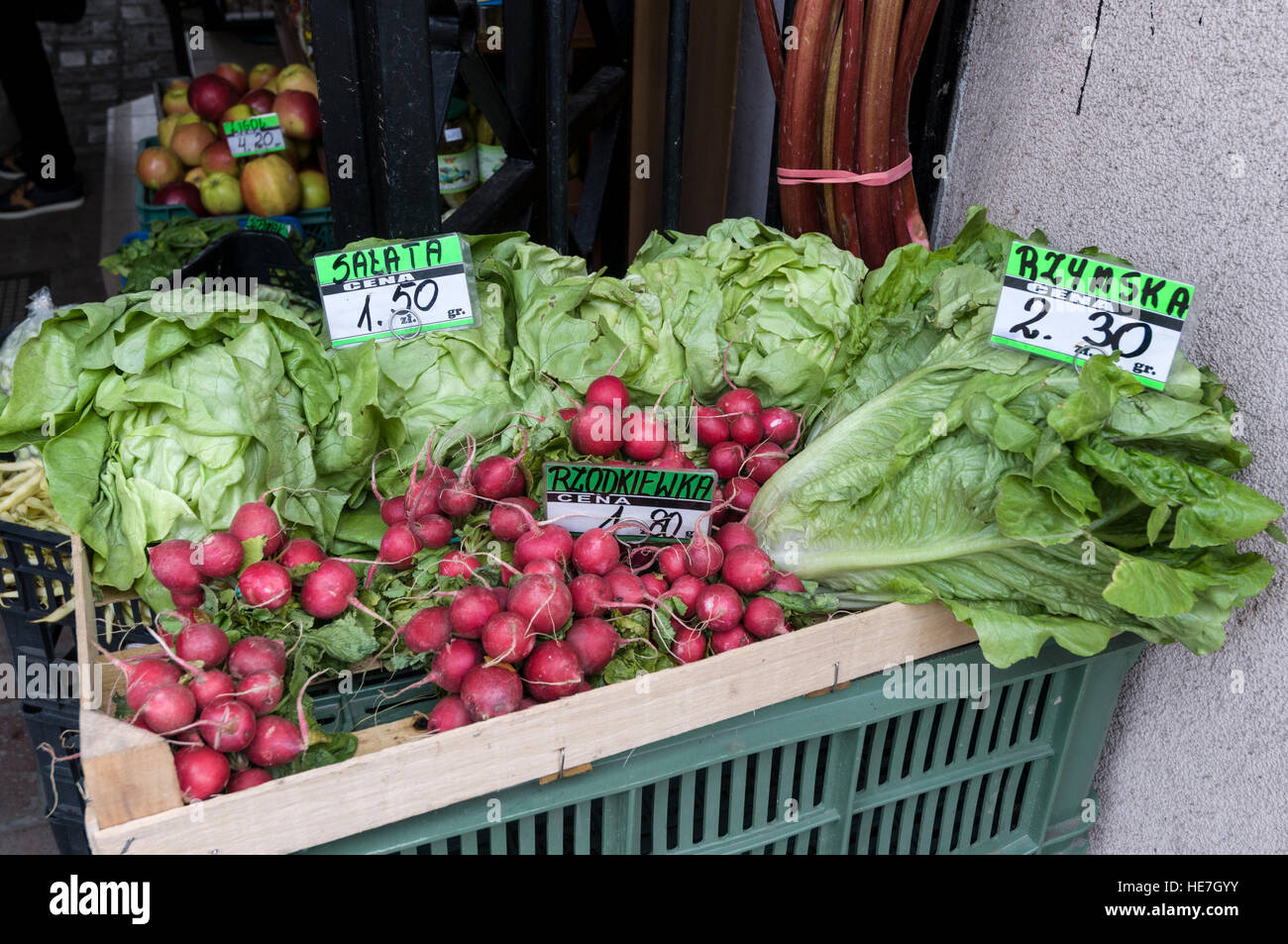 Horse radish and lettuce on sale at a vegetable store in Limanowskiego street, Krakow, Poland. Stock Photo