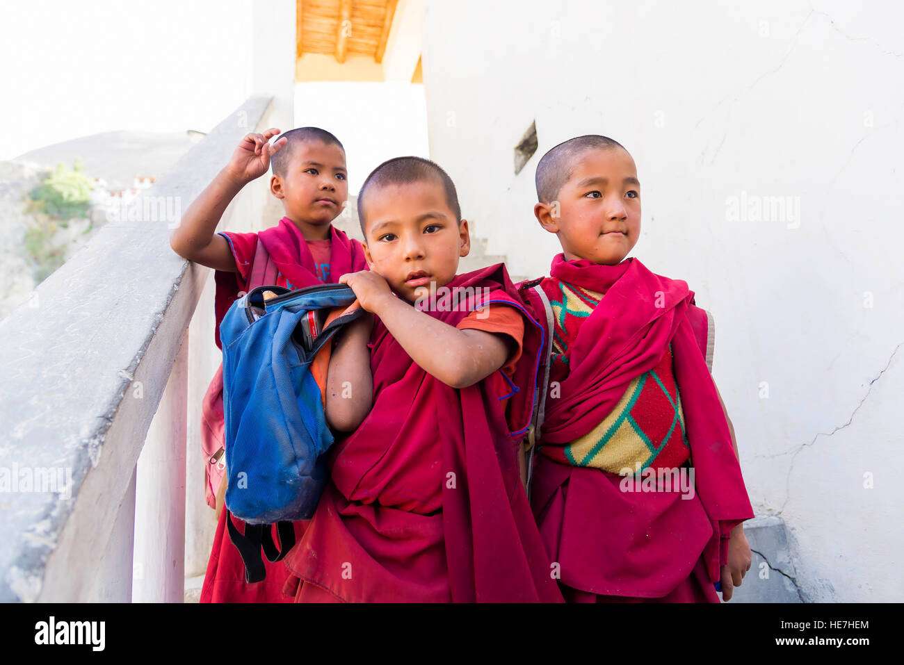 Diskit, India - August 20, 2015: Three young monks leaving Diskit monastery school. Stock Photo