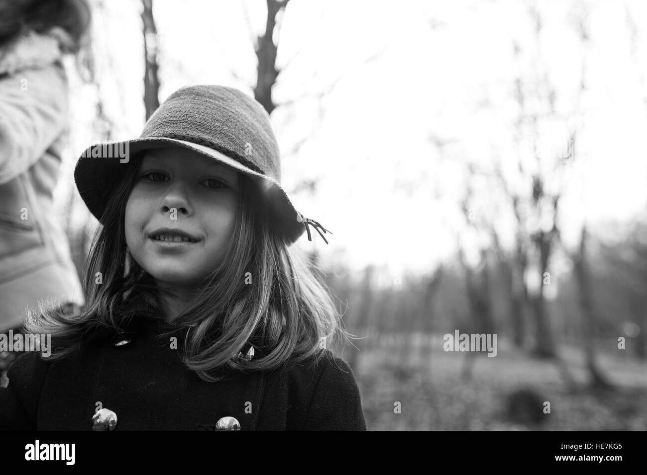 little girl in a black coat and hat Stock Photo - Alamy