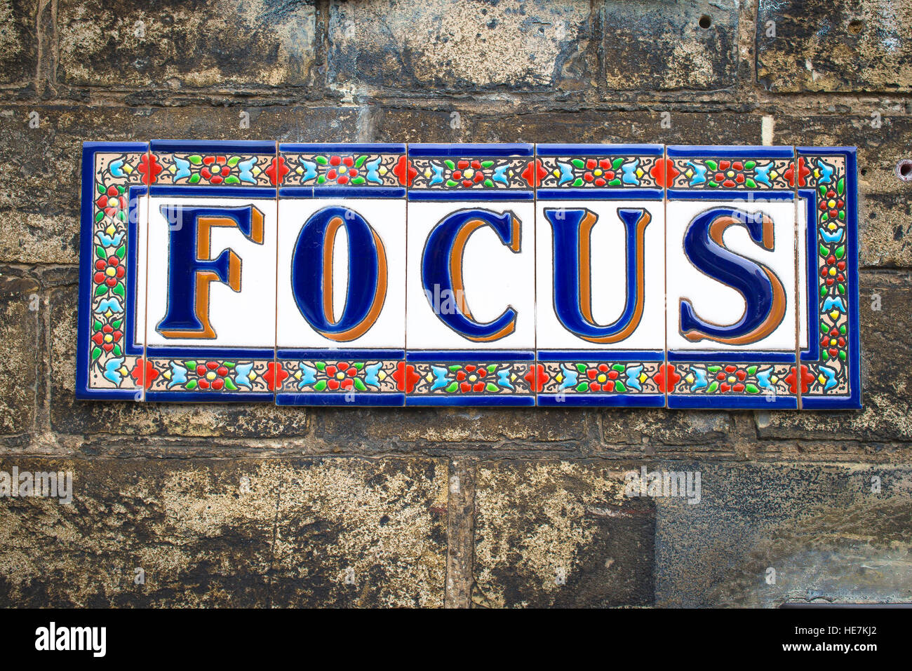 Focus word sign, sign of the word 'focus' on a wall in Suffolk, UK Stock Photo