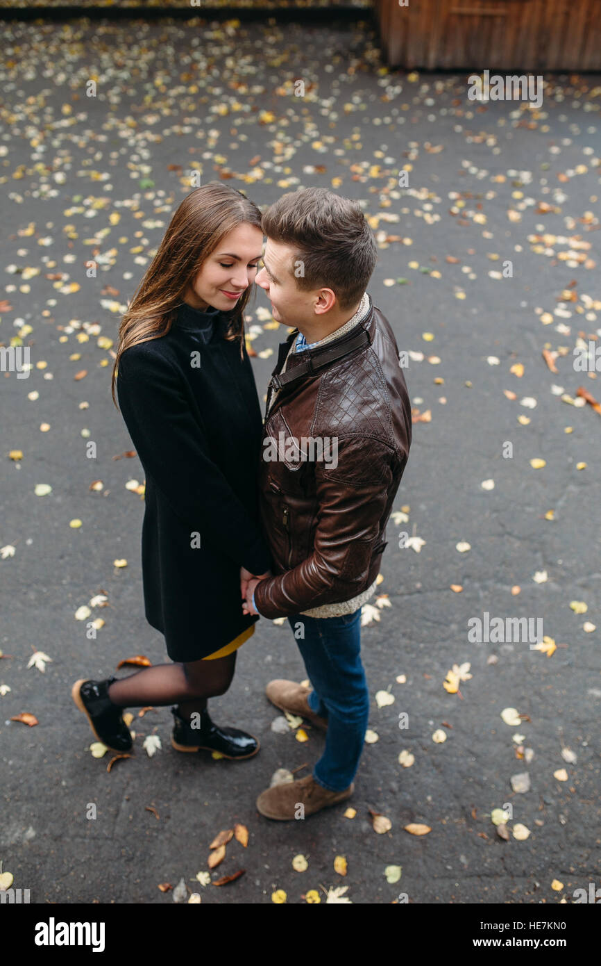 attractive happy couple walking in autumn park Stock Photo - Alamy