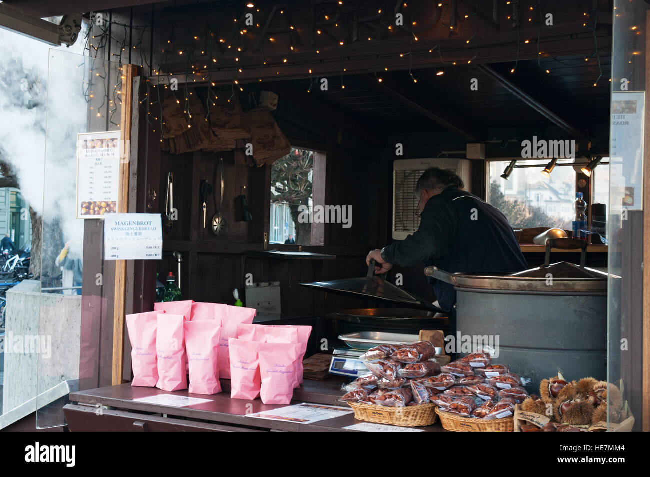 Switzerland, Europe: a street seller of roasted chestnuts in the medieval city of Lucerne Stock Photo