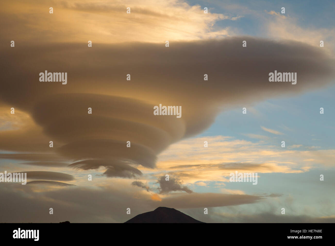 Altocumulus lenticularis or lenticular cloud in Bolivia Stock Photo
