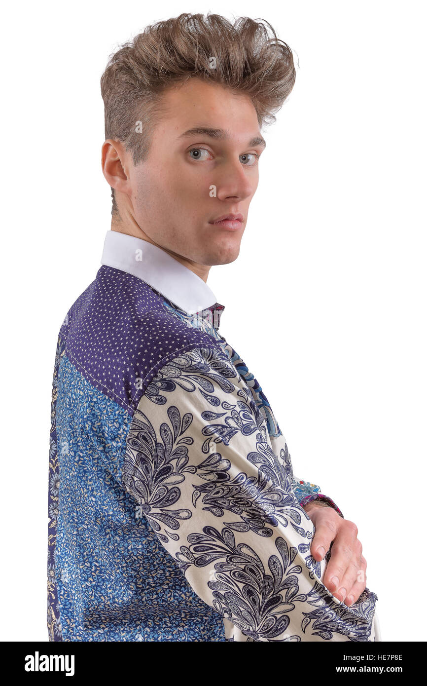 Stylish man dressed in a blue and white formal floral shirt, looking over shoulder Stock Photo