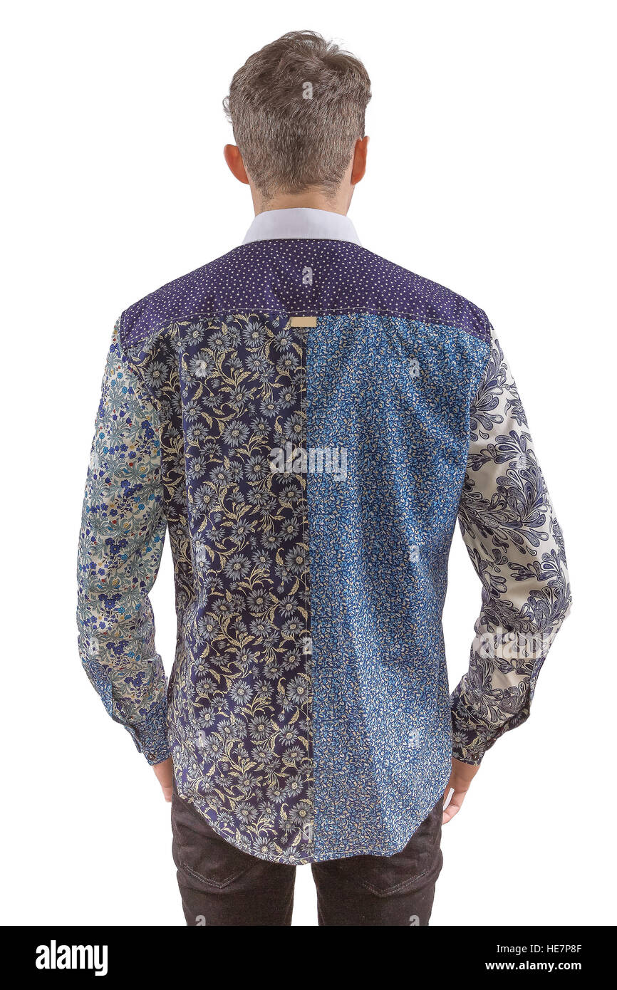Stylish man dressed in a blue formal floral panel shirt and black pants, from back Stock Photo