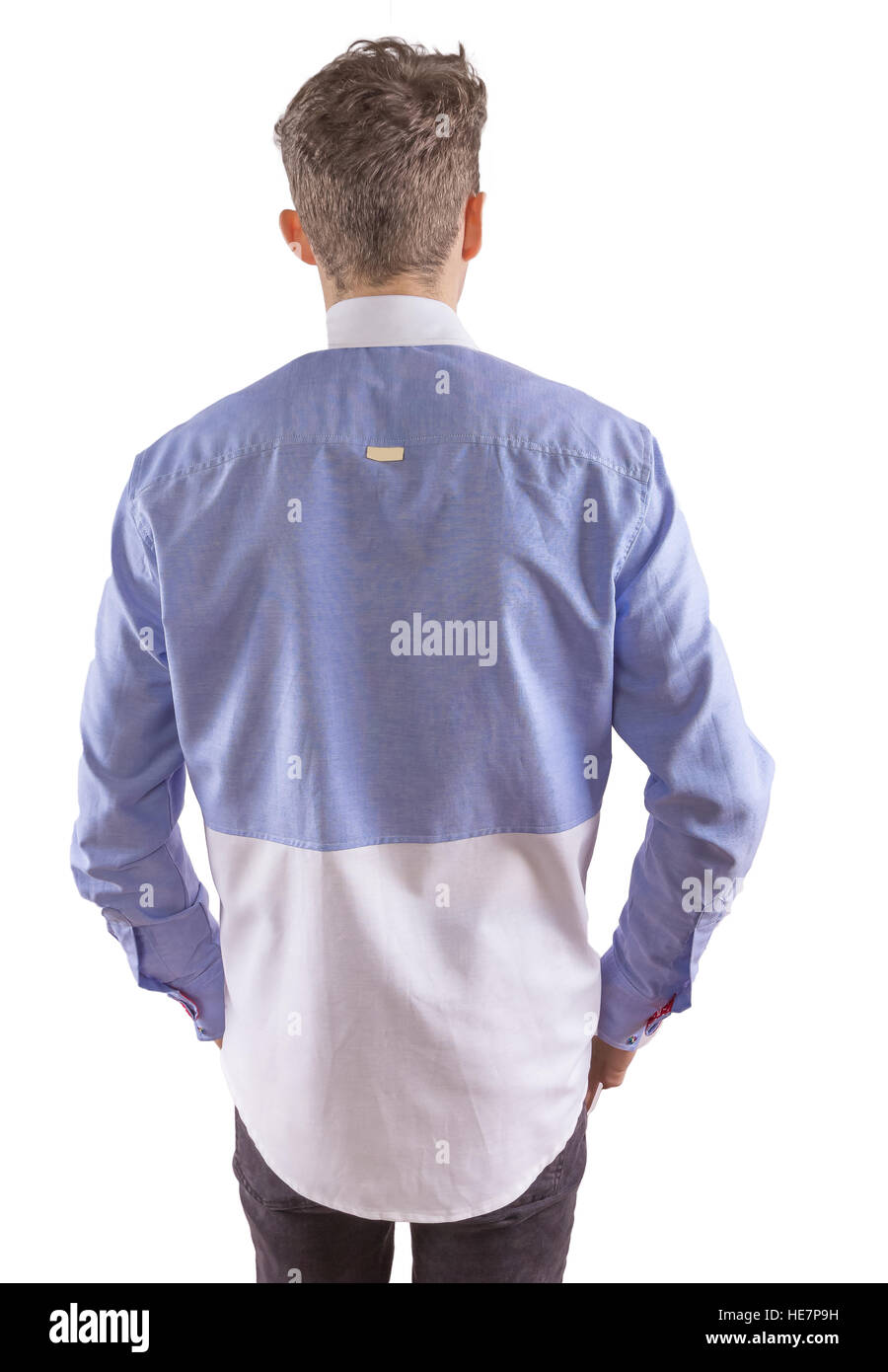 Stylish man dressed in a blue and white formal shirt, viewed from back Stock Photo