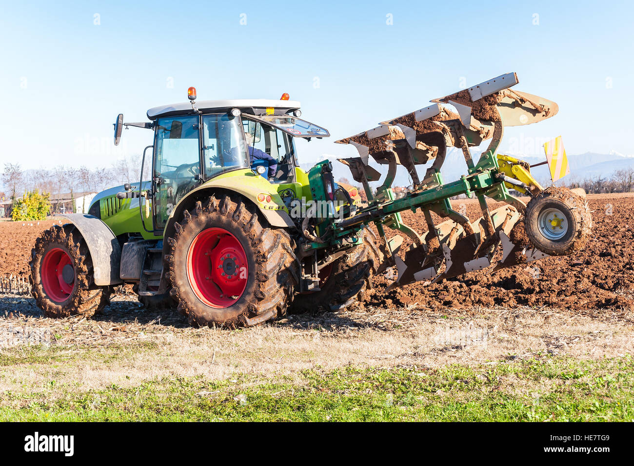 Tractor with plow hires stock photography and images Alamy