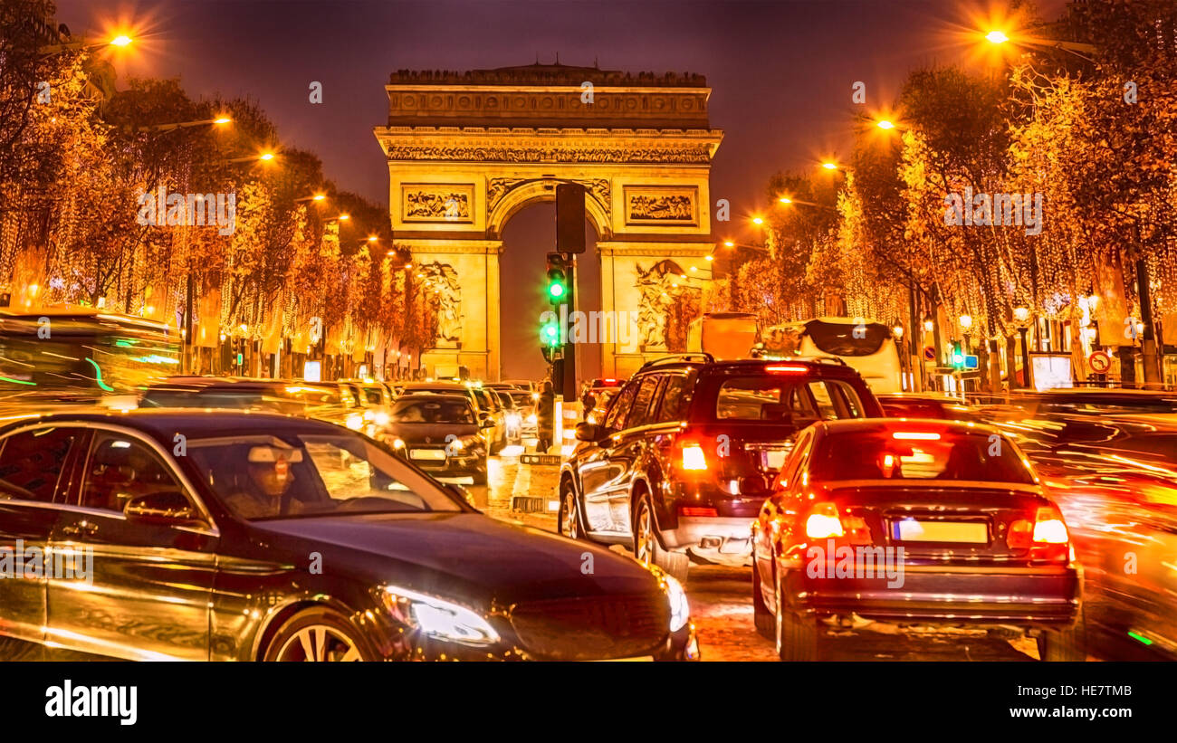 Night image of the crowded traffic in Paris on Champs Elysees during the winter holidays. Stock Photo