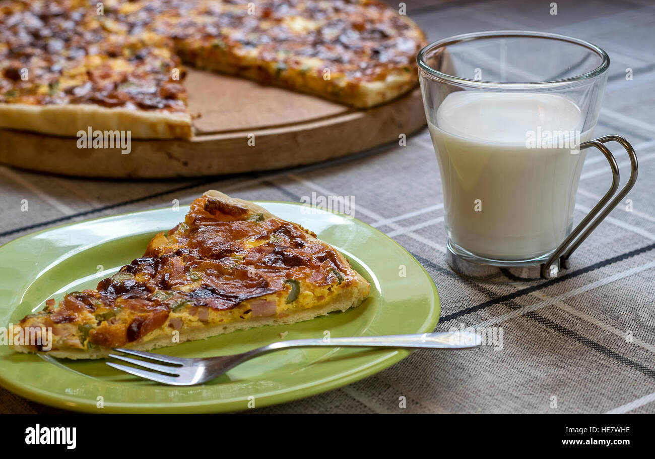 Homemade quiche (tart) with pickles, ham, prosciutto and cheese Stock