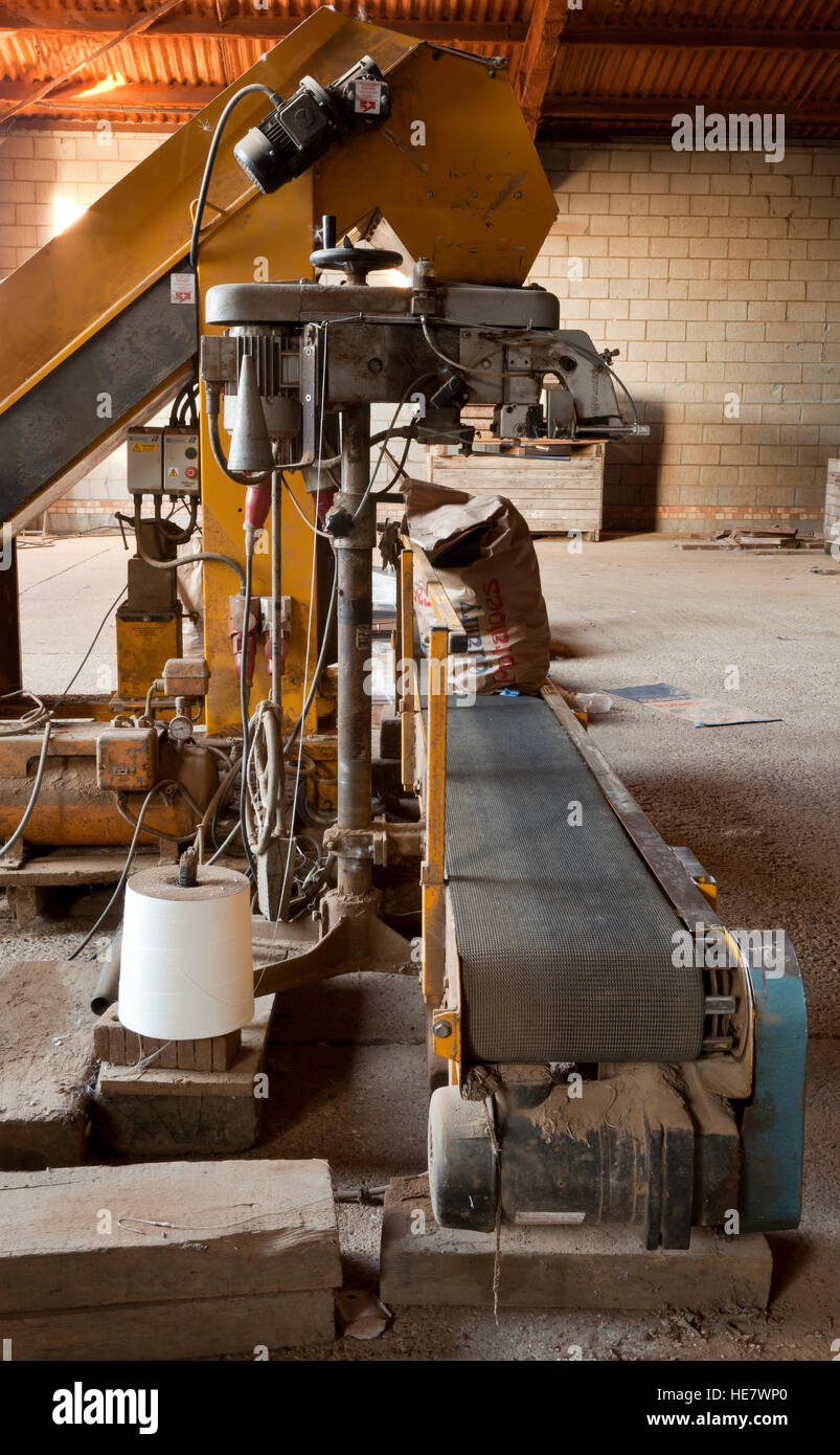 An agricultural potato bagging and stitching machine Stock Photo