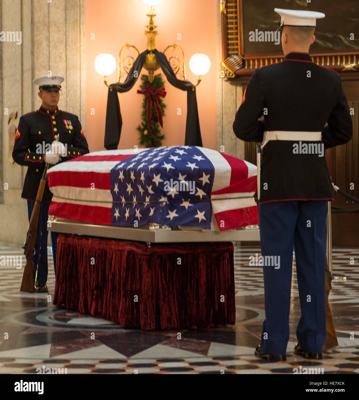U.S. Marines stand guard by the casket of astronaut and former Senator John Glenn in repose at the Ohio Statehouse December 16, 2016 in Columbus, Ohio. The former Marine pilot, Senator and first man to orbit the earth died last week at the age of 95. Stock Photo
