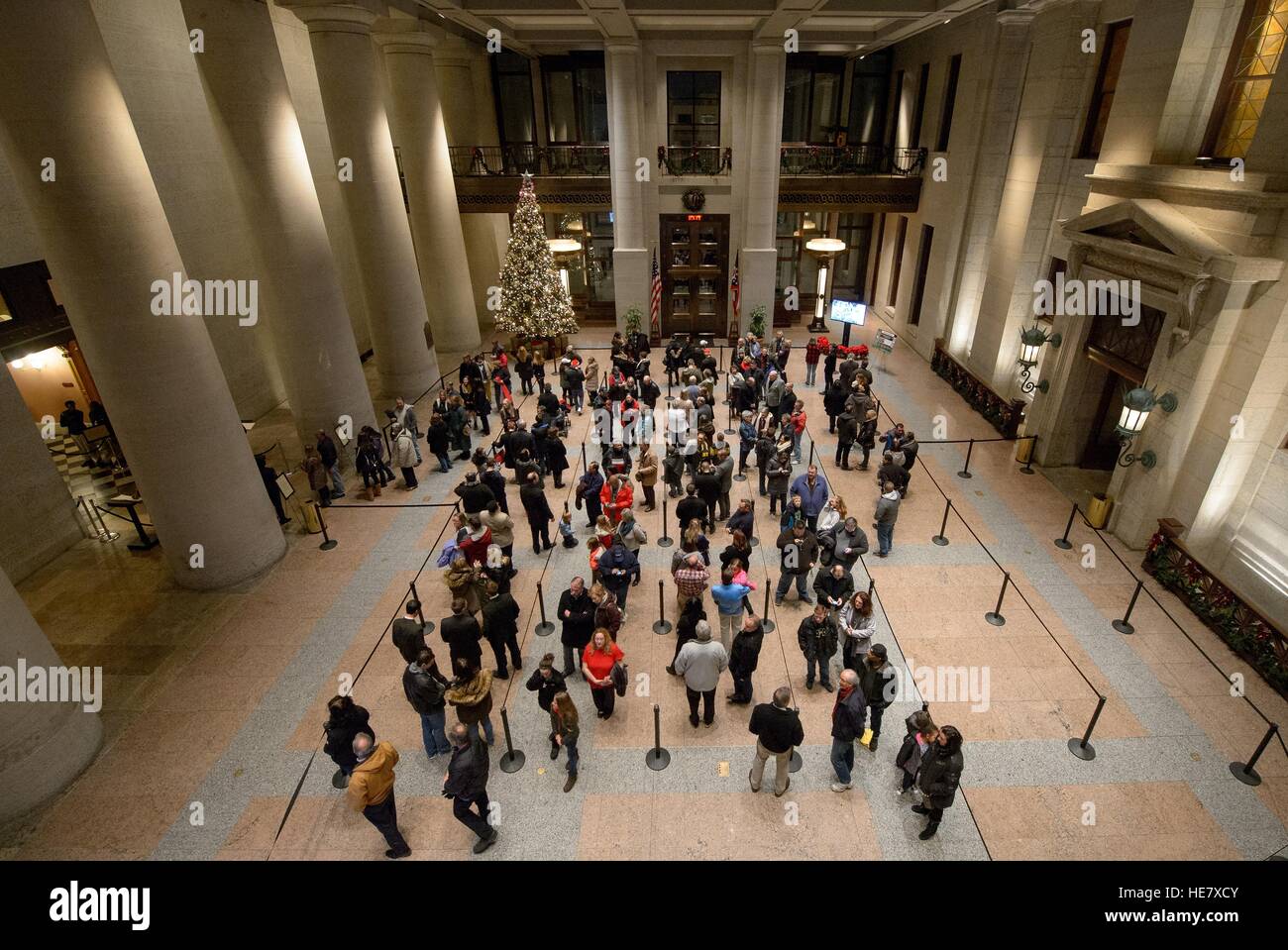 Members of the public wait in line to pay their respects to astronaut and former Senator John Glenn in repose at the Ohio Statehouse December 16, 2016 lying in Columbus, Ohio. The former Marine pilot, Senator and first man to orbit the earth died last week at the age of 95. Stock Photo