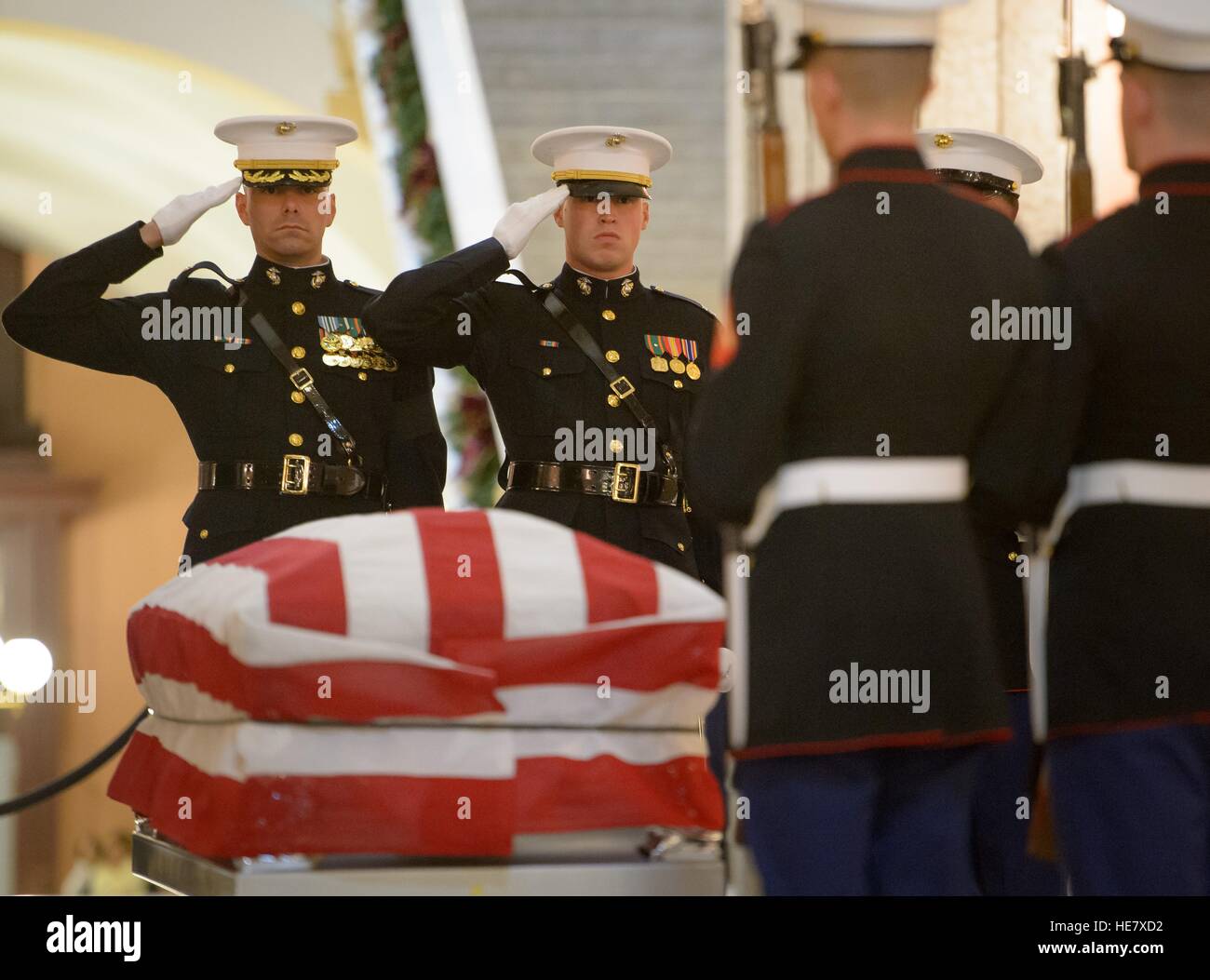 U.S. Marines stand guard by the casket of astronaut and former Senator John Glenn in repose at the Ohio Statehouse December 16, 2016 in Columbus, Ohio. The former Marine pilot, Senator and first man to orbit the earth died last week at the age of 95. Stock Photo
