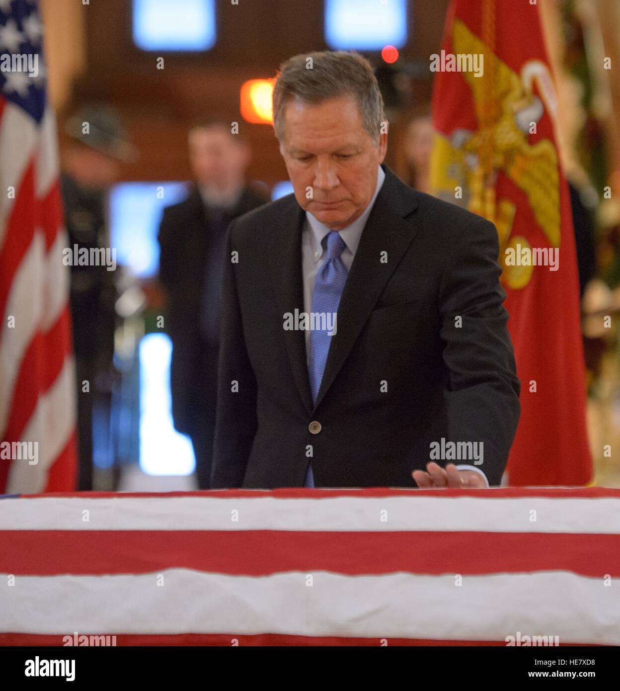 Ohio Gov. John Kasich pays his respect to astronaut and former Senator John Glenn in repose at the Ohio Statehouse December 16, 2016 in Columbus, Ohio. The former Marine pilot, Senator and first man to orbit the earth died last week at the age of 95. Stock Photo