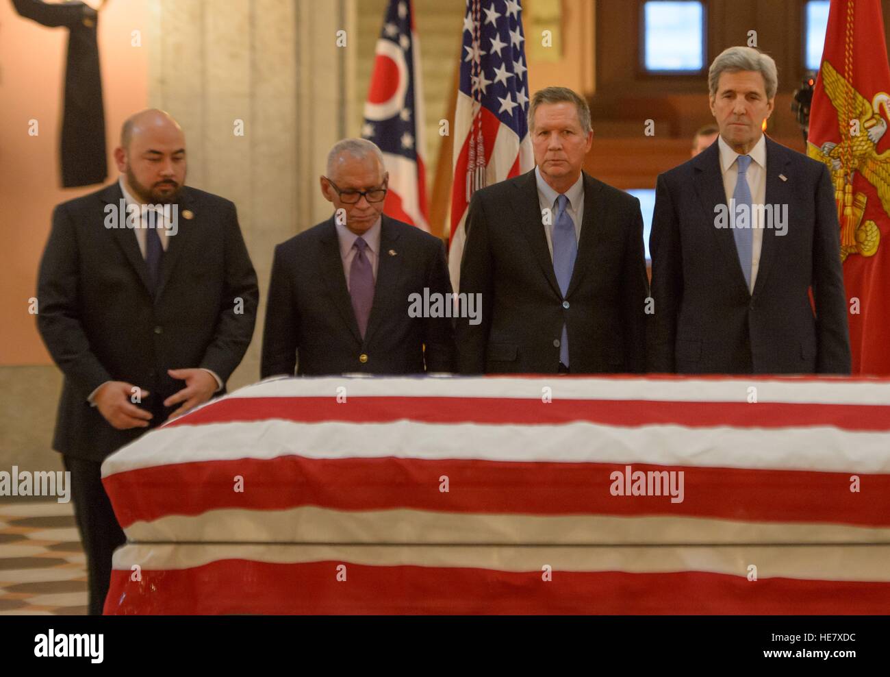 Speaker of the Ohio House of Representatives Cliff Rosenberger, left, NASA Administrator Charles Bolden, Ohio Gov. John Kasich, and Secretary of State John Kerry pay their respects to astronaut and former Senator John Glenn in repose at the Ohio Statehouse December 16, 2016 in Columbus, Ohio. The former Marine pilot, Senator and first man to orbit the earth died last week at the age of 95. Stock Photo